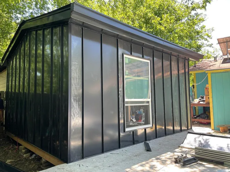 Black standing seam metal wall panels for Roof Inspection in Westport