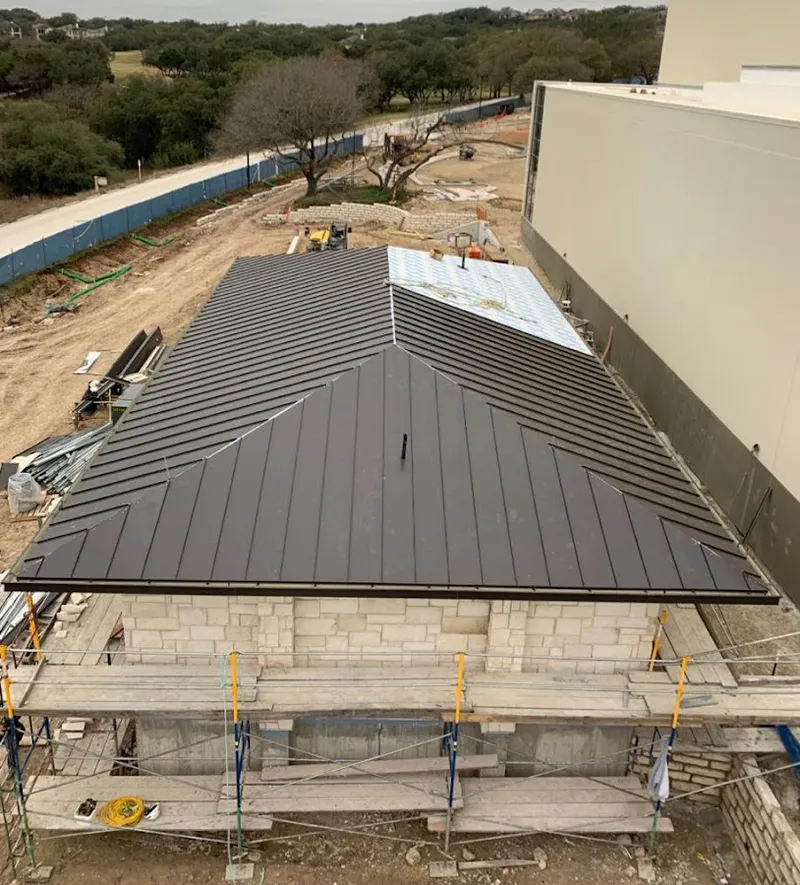 Metal roof new construction with scaffolding in Westport
